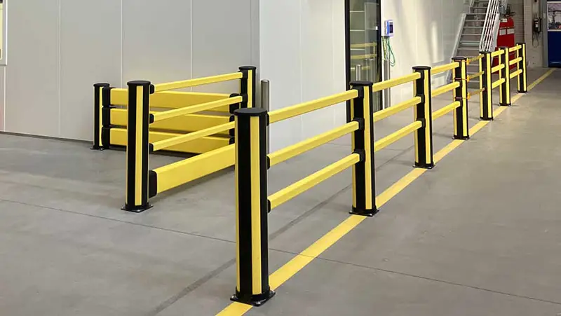 pedestrian barriers in black and yellow